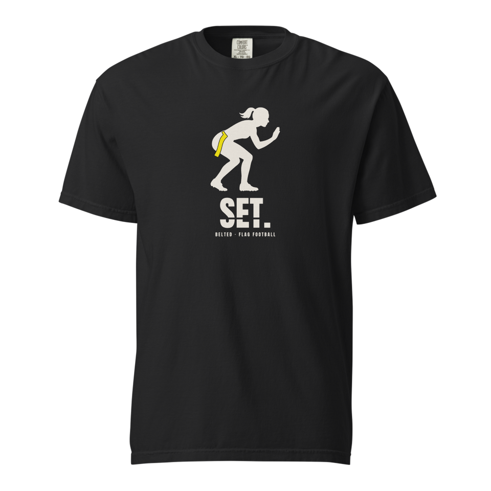 Black Set Tee, front: Ivory crouching player silhouette with a yellow flag at the hip, SET. and Belted - Flag Football below