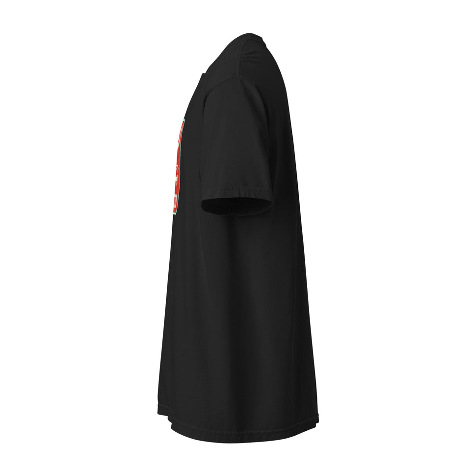 Badge Tee, black, left side view: short sleeve in profile, edge of the red badge visible at the chest